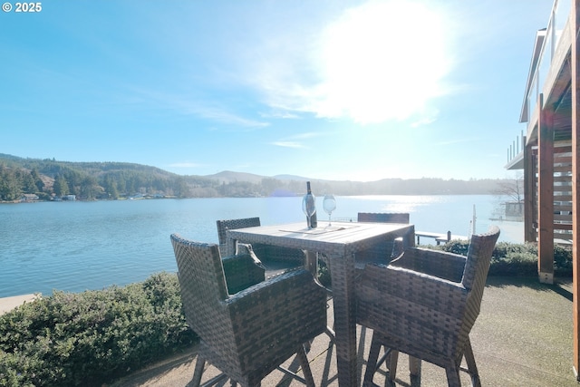 1508 NE Lake Dr, Lincoln City, OR 97367 - view of patio / terrace featuring a water and mountain view