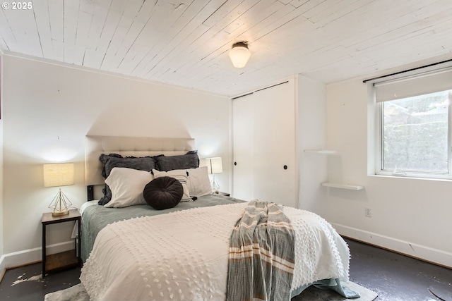 bedroom with wood ceiling and a closet