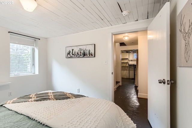 bedroom featuring crown molding and wood ceiling