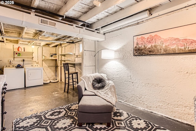 basement featuring washing machine and dryer