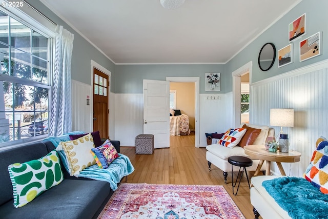 living room featuring crown molding and hardwood / wood-style floors