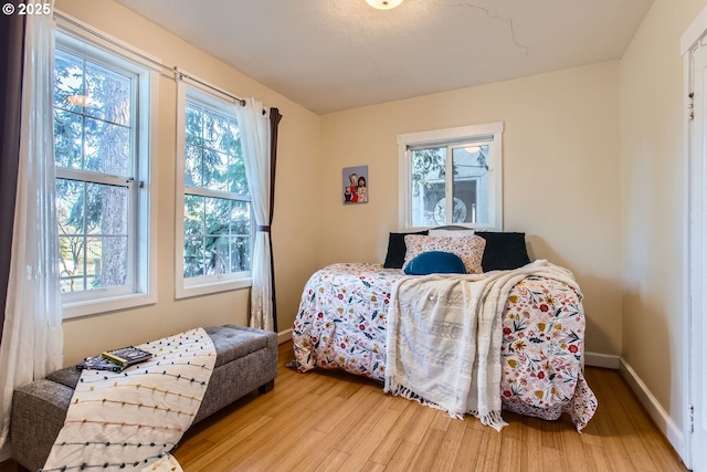 bedroom with light wood-type flooring