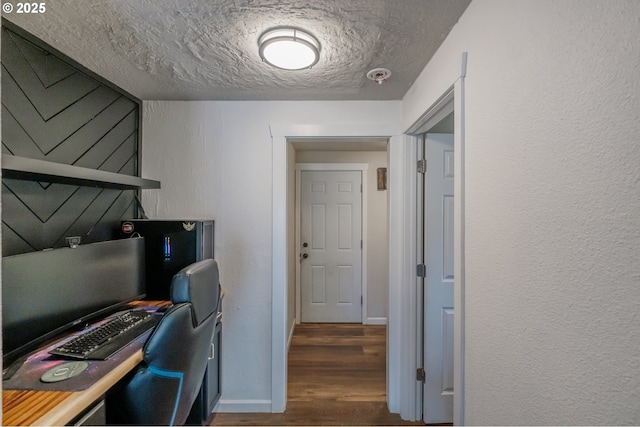 2261 Fulton Pl SE, Albany, OR 97322 - office featuring a textured ceiling, dark wood-style flooring, a textured wall, and baseboards