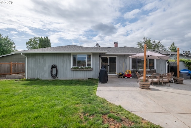 2261 Fulton Pl SE, Albany, OR 97322 - rear view of property with a patio area, a chimney, and roof with shingles