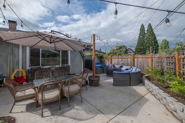 2261 Fulton Pl SE, Albany, OR 97322 - fenced backyard featuring an outdoor hangout area, a patio, and outdoor dining area
