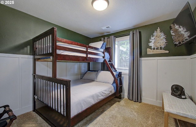 7716 NE 136th Ave, Vancouver, WA 98682 - carpeted bedroom featuring a decorative wall and wainscoting
