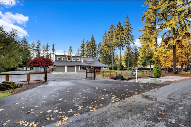 12610 NE Potter Rd, Battle Ground, WA 98604 - view of front of home with a gate, asphalt driveway, and a garage