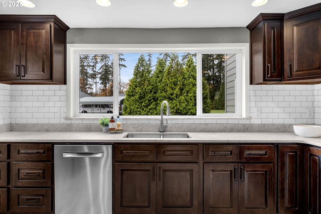 kitchen with dark brown cabinetry, sink, and dishwasher