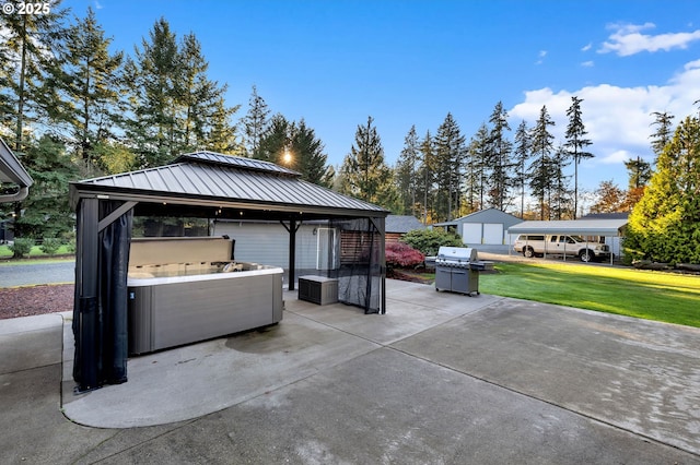 view of patio / terrace with a gazebo, a hot tub, and a carport