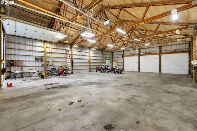 garage with metal wall and a garage door opener