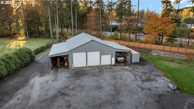 garage featuring a lawn