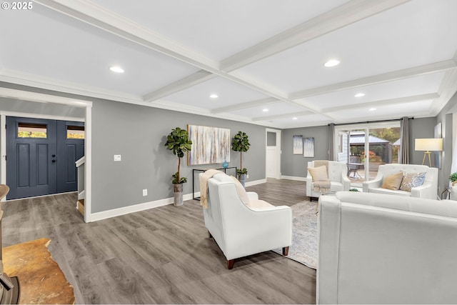 living room featuring coffered ceiling, light hardwood / wood-style floors, and beamed ceiling