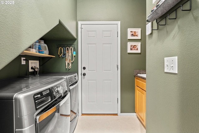 laundry room with washer and clothes dryer