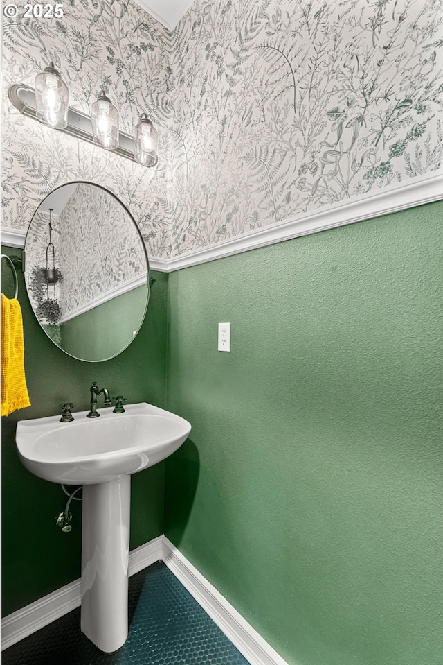 bathroom with tile patterned floors, wallpapered walls, and baseboards