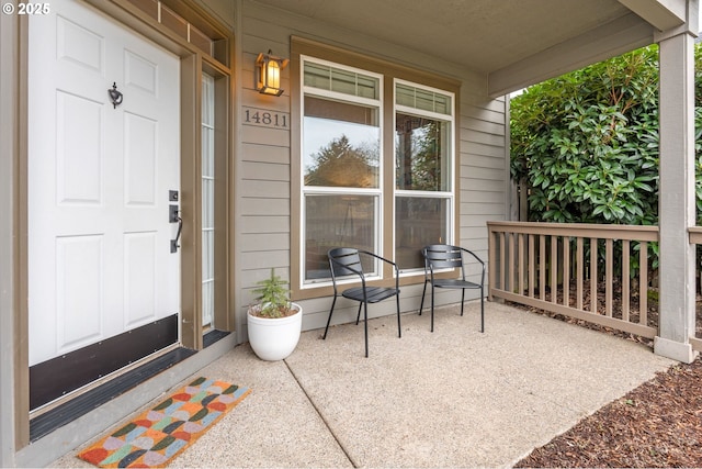 view of exterior entry with a porch