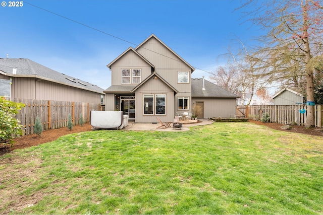 back of property featuring a yard, a fenced backyard, and a patio area