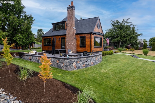 7506 SE Evergreen Hwy, Vancouver, WA 98664 - back of house with roof with shingles, a patio area, a yard, a chimney, and an outdoor fire pit