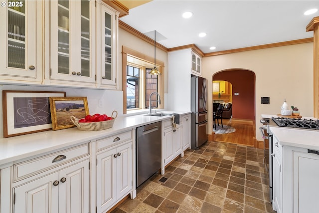 7506 SE Evergreen Hwy, Vancouver, WA 98664 - kitchen featuring appliances with stainless steel finishes, arched walkways, crown molding, stone tile floors, and recessed lighting