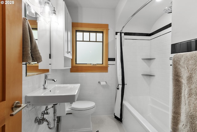 7506 SE Evergreen Hwy, Vancouver, WA 98664 - bathroom with tile patterned flooring, shower / bath combo with shower curtain, and tile walls