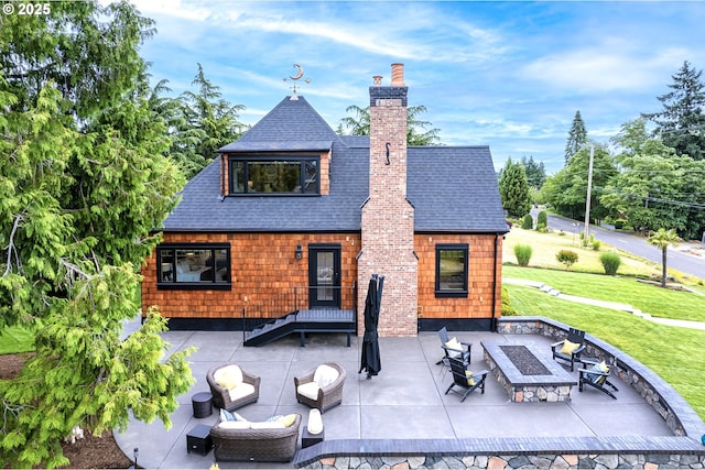 7506 SE Evergreen Hwy, Vancouver, WA 98664 - back of house featuring a shingled roof, a chimney, a lawn, a patio area, and an outdoor living space with a fire pit