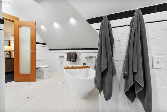 7506 SE Evergreen Hwy, Vancouver, WA 98664 - full bath featuring tile walls, lofted ceiling, and tile patterned flooring