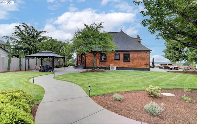 7506 SE Evergreen Hwy, Vancouver, WA 98664 - back of house featuring a gazebo, roof with shingles, and a chimney