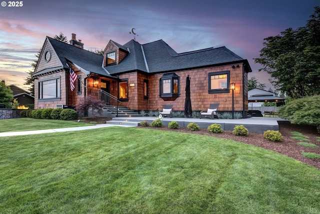 7506 SE Evergreen Hwy, Vancouver, WA 98664 - view of front of home featuring a shingled roof, a chimney, and a lawn