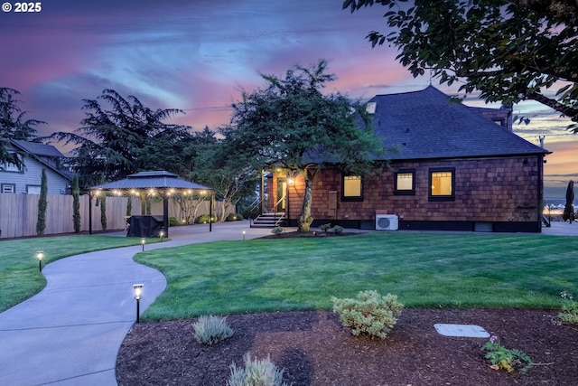 7506 SE Evergreen Hwy, Vancouver, WA 98664 - rear view of house with a gazebo and roof with shingles