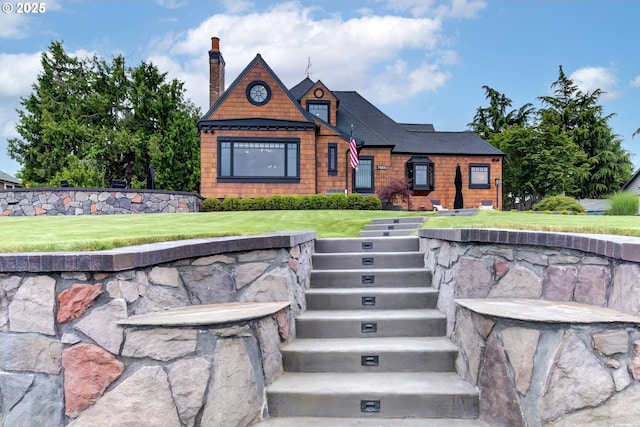 7506 SE Evergreen Hwy, Vancouver, WA 98664 - view of front of house featuring a chimney, a front lawn, and roof with shingles