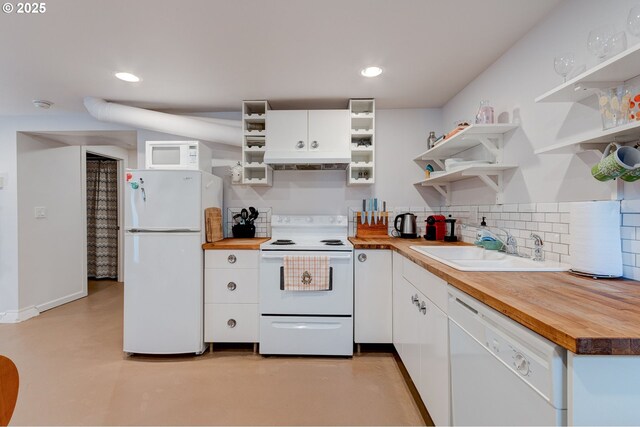 kitchen featuring wooden counters, open shelves, white appliances, white cabinetry, and a sink