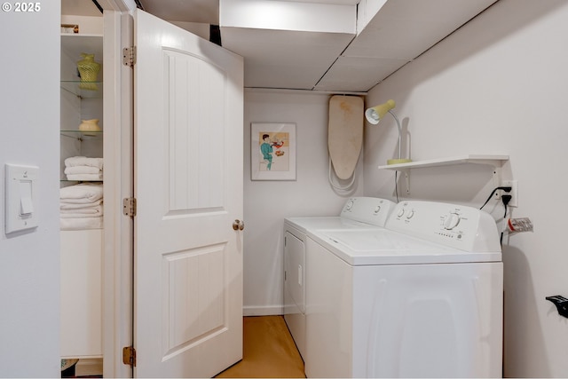 washroom featuring laundry area and washing machine and dryer