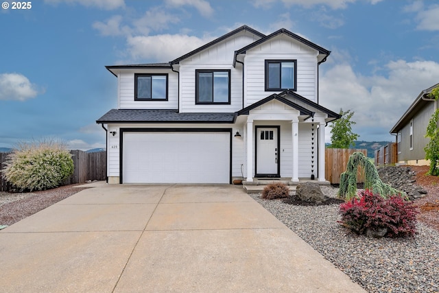 625 Brady Ln, Roseburg, OR 97471 - view of front of house featuring a garage, driveway, board and batten siding, and a shingled roof