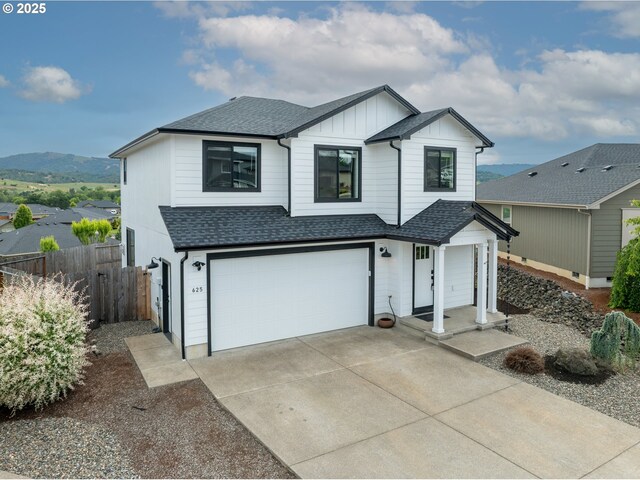 625 Brady Ln, Roseburg, OR 97471 - view of front of home featuring roof with shingles, an attached garage, board and batten siding, and concrete driveway
