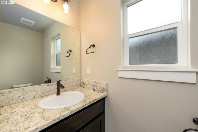 625 Brady Ln, Roseburg, OR 97471 - bathroom featuring plenty of natural light, vanity, and toilet