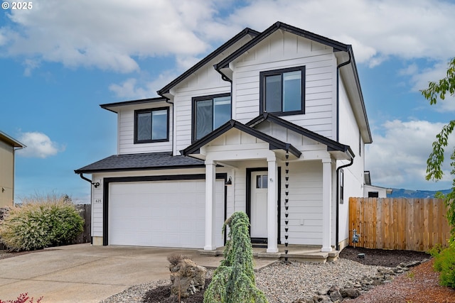 625 Brady Ln, Roseburg, OR 97471 - view of front of house featuring an attached garage, board and batten siding, driveway, and roof with shingles