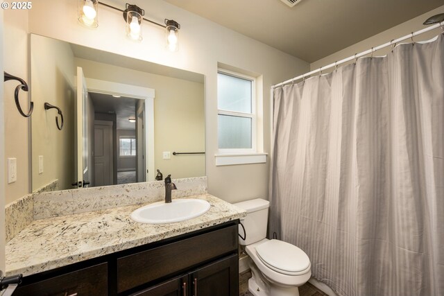 625 Brady Ln, Roseburg, OR 97471 - full bath featuring toilet, vanity, and a shower with shower curtain