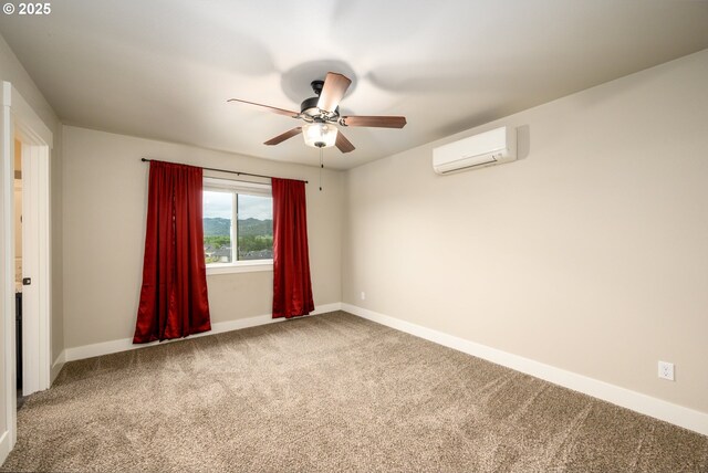 625 Brady Ln, Roseburg, OR 97471 - spare room with ceiling fan, an AC wall unit, carpet, and baseboards