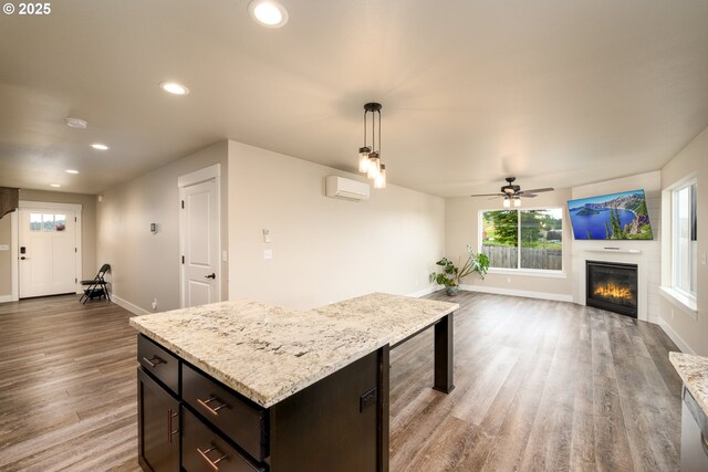 625 Brady Ln, Roseburg, OR 97471 - kitchen with baseboards, recessed lighting, a wall mounted air conditioner, a ceiling fan, and wood finished floors