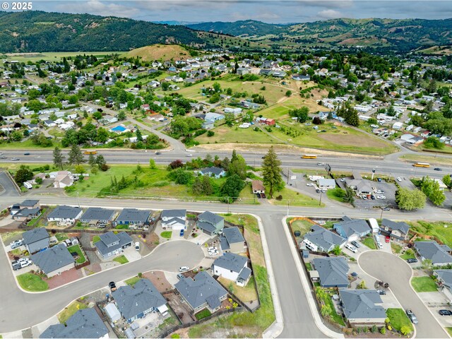 625 Brady Ln, Roseburg, OR 97471 - aerial view of property's location with nearby suburban area and a mountain backdrop