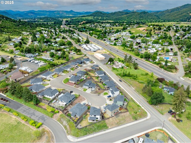 625 Brady Ln, Roseburg, OR 97471 - aerial view of property's location featuring a mountainous background and nearby suburban area