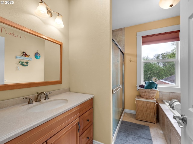 full bathroom featuring vanity, tiled tub, tile patterned flooring, and a stall shower