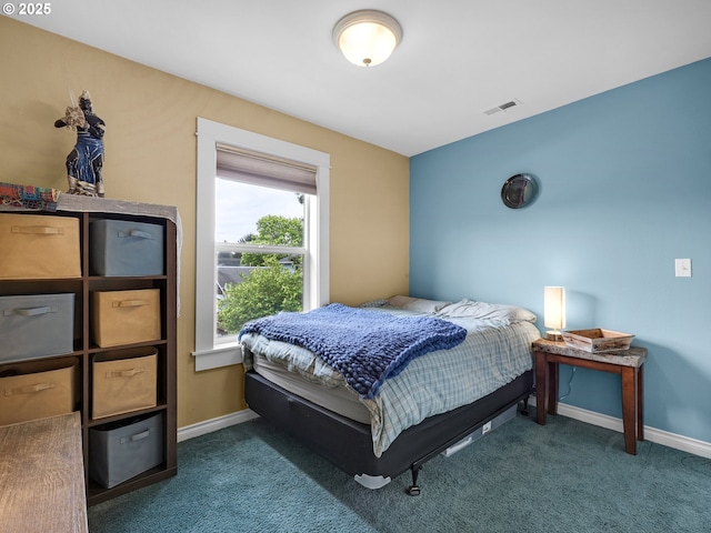 bedroom featuring baseboards, carpet, and visible vents