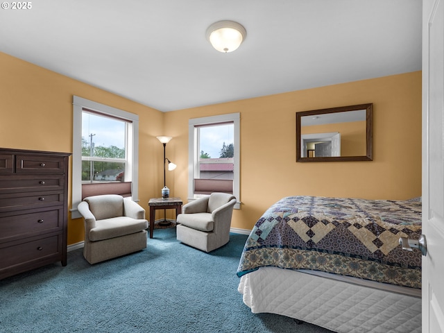 bedroom featuring carpet floors and baseboards