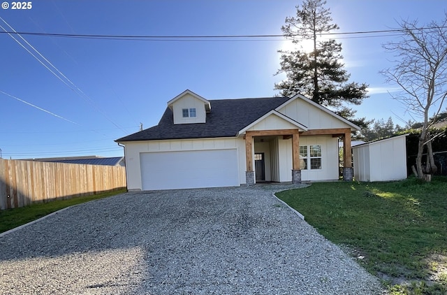 view of front facade with a garage and a front lawn