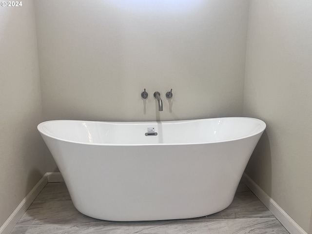 bathroom featuring a washtub