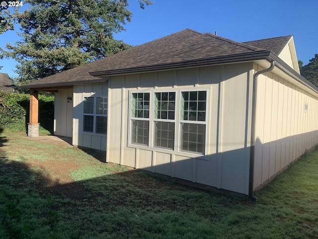 view of home's exterior featuring a yard