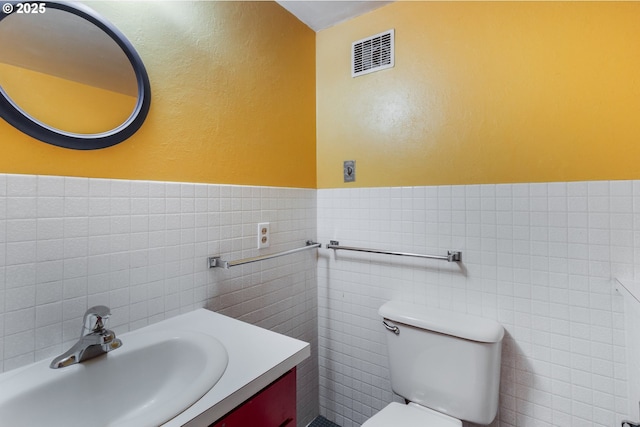 2362 Charnelton St, Eugene, OR 97405 - bathroom featuring vanity, tile walls, and a wainscoted wall