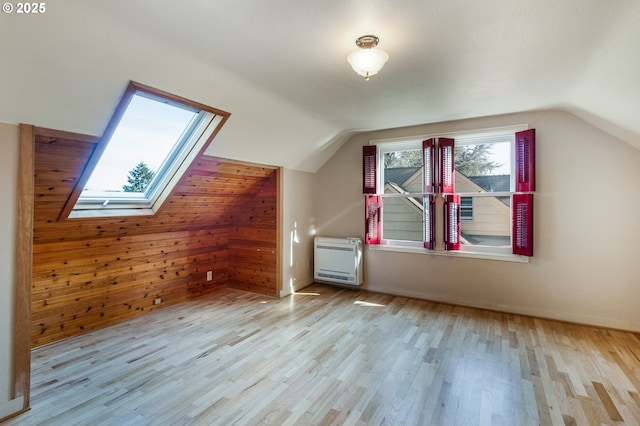 2362 Charnelton St, Eugene, OR 97405 - bonus room with heating unit, lofted ceiling, a skylight, wood finished floors, and wood walls