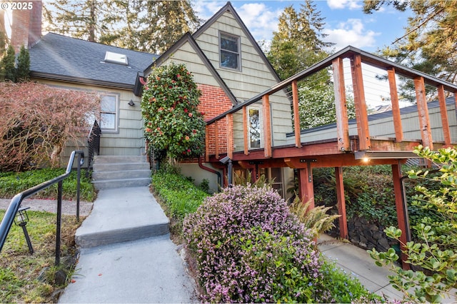2362 Charnelton St, Eugene, OR 97405 - back of house featuring a wooden deck and a shingled roof