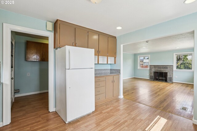 7515 SE Luther Rd, Portland, OR 97206 - kitchen with freestanding refrigerator, light wood-style floors, baseboards, open floor plan, and recessed lighting